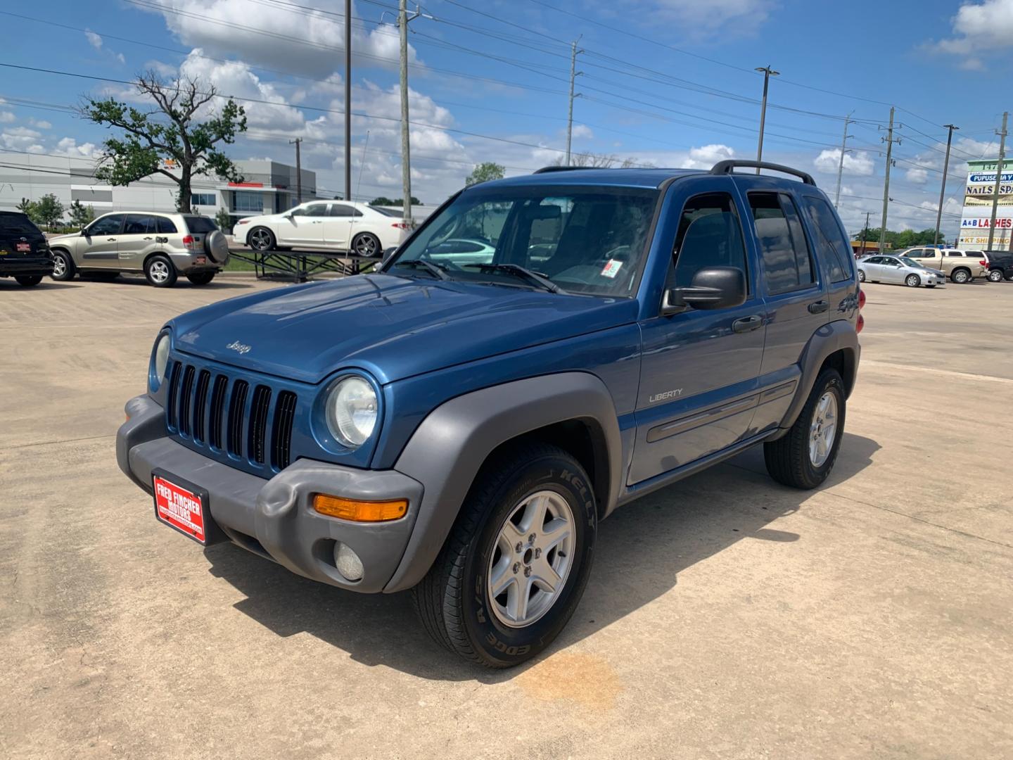 2004 blue /black Jeep Liberty Columbia Edition 2WD (1J4GK48KX4W) with an 3.7L V6 SOHC 12V engine, Automatic transmission, located at 14700 Tomball Parkway 249, Houston, TX, 77086, (281) 444-2200, 29.928619, -95.504074 - Photo#2